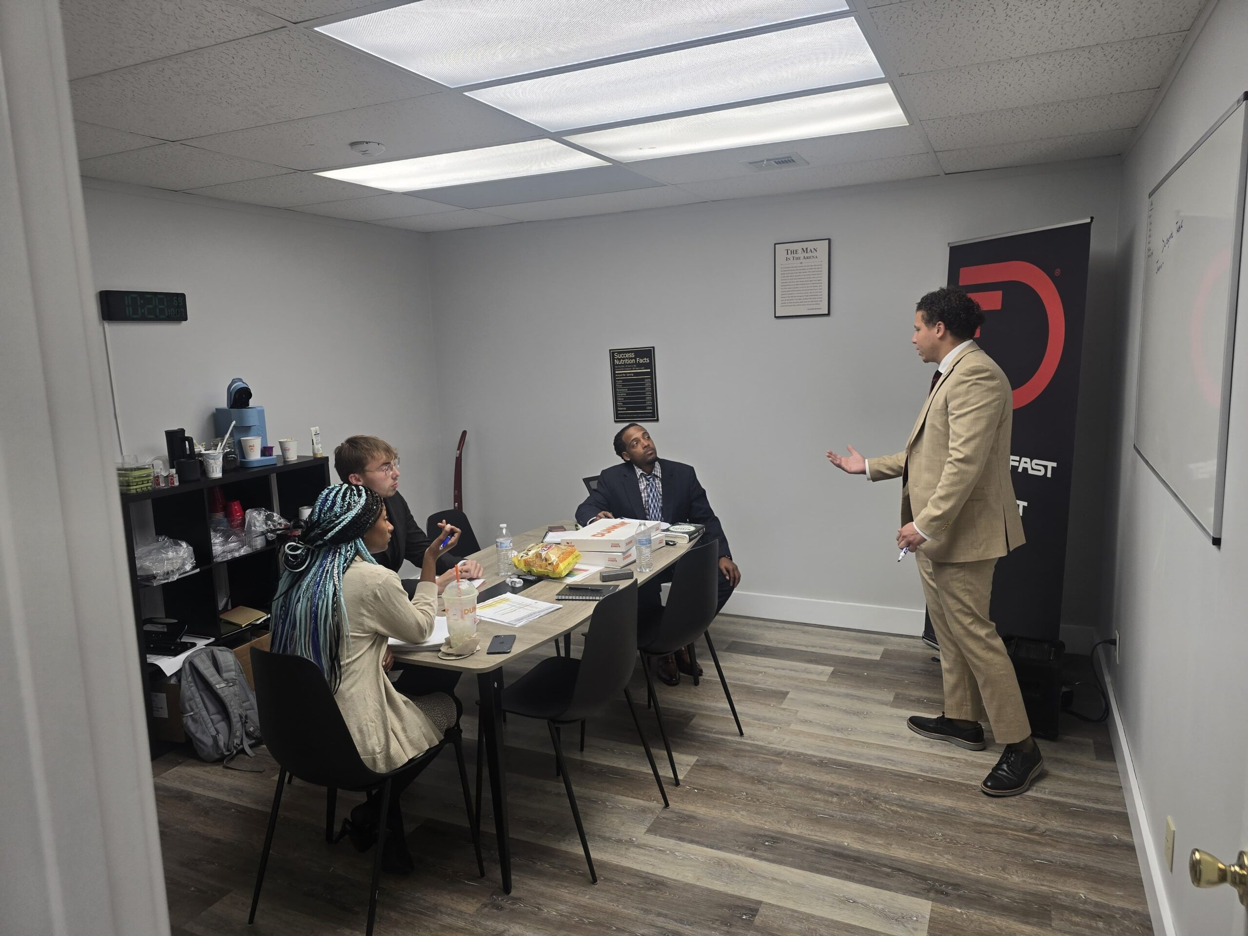 Team gathered around a table reviewing business growth strategies in the office.